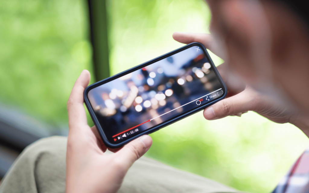 A person watching a video on their mobile device