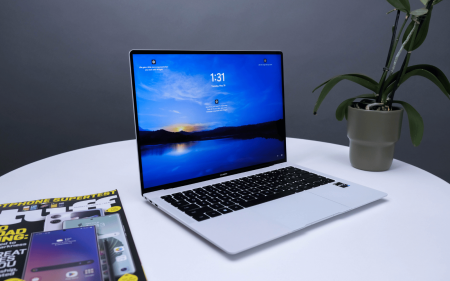 The Huawei Matebook X Pro, with plant and magazine