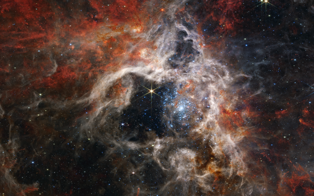 Tarantula nebula – NASA, The Conversation, CC) (Higgs)