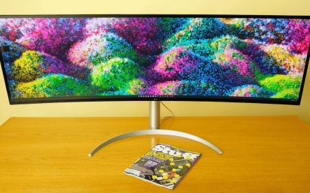 The LG UltraWide 49WQ95C-W with a Stuff magazine