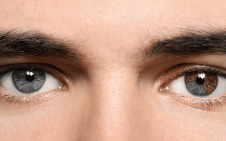 A man with blue and brown eyes