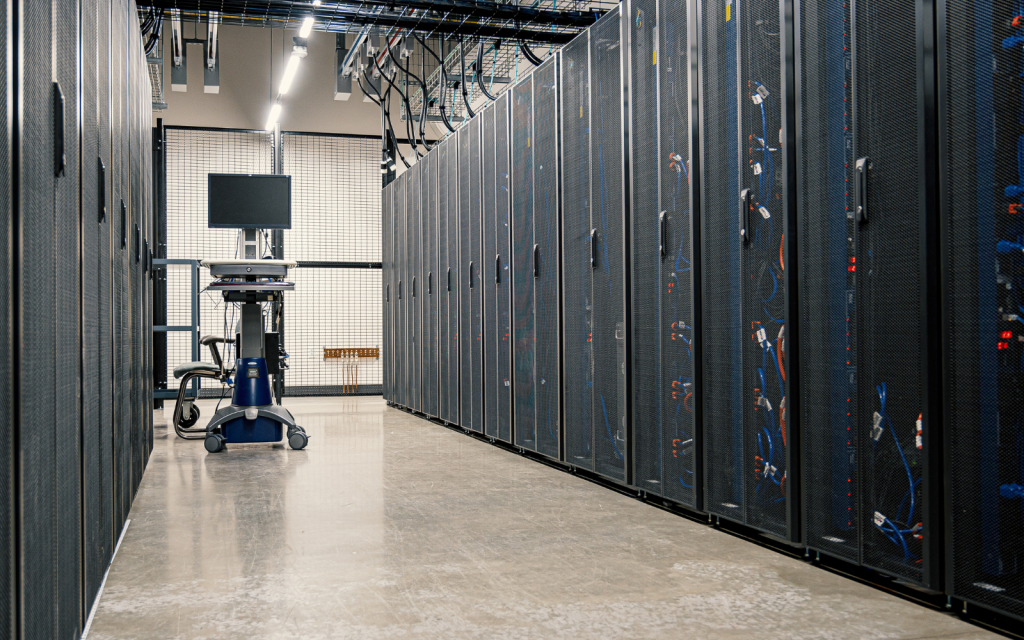 Data that is stored and not used has a carbon footprint – how companies can manage dark data better Server racks data storage header
