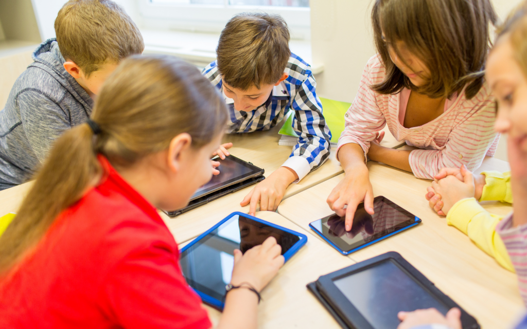 Can AI keep students motivated, or does it do the opposite? Kids using tablets (AI) header