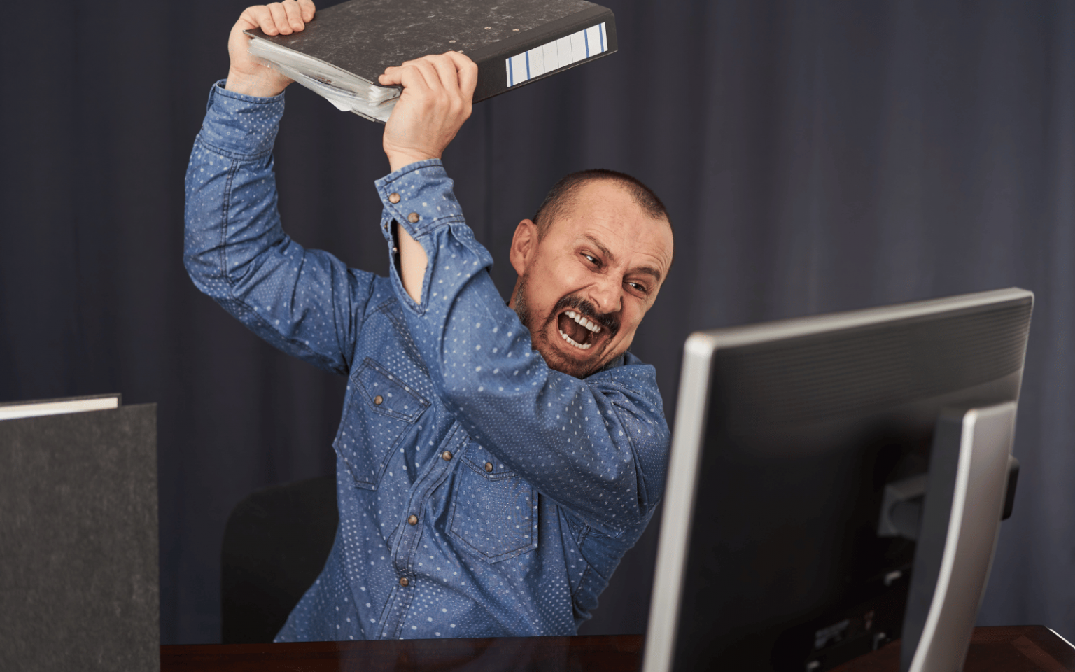 Angry man smashing PC (Cloudflare)
